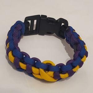 Purple & Gold w/Blue Paracord Bracelet. It is also known as a Survival Bracelet